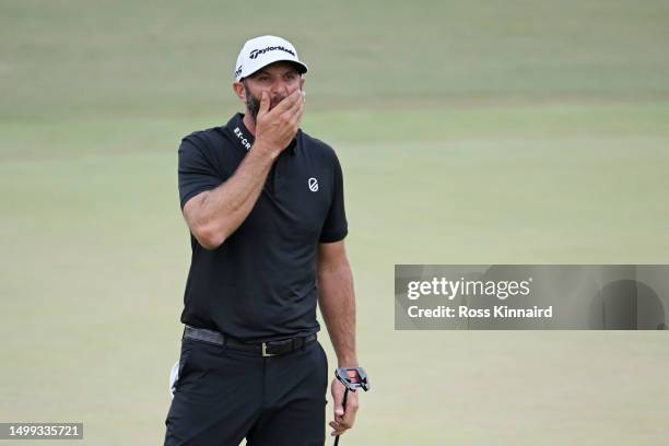 Dustin Johnson of the United States reacts to his birdie attempt on the 18th green during the third round of the 123rd U.S. Open Championship at The...