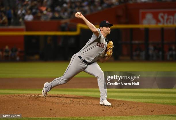 Shane Bieber of the Cleveland Guardians delivers a first inning pitch against the Arizona Diamondbacks at Chase Field on June 17, 2023 in Phoenix,...