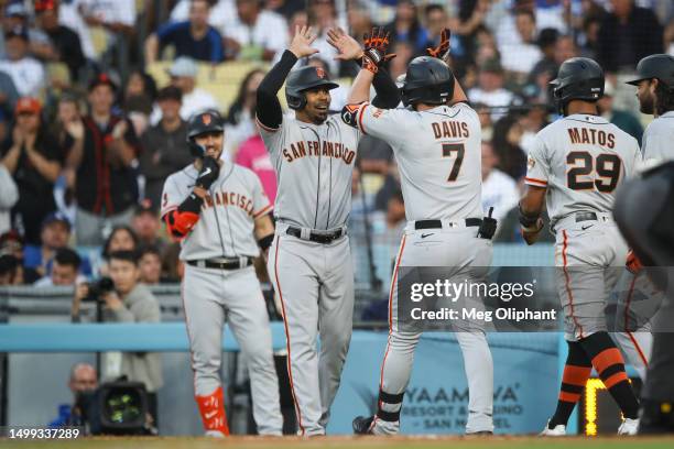 Davis of the San Francisco Giants celebrates after hitting a grand slam in the sixth inning against the Los Angeles Dodgers at Dodger Stadium on June...