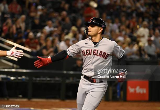 Andre Gimenez of the Cleveland Guardians celebrates with teammates after hitting a solo home run against the Arizona Diamondbacks during the third...