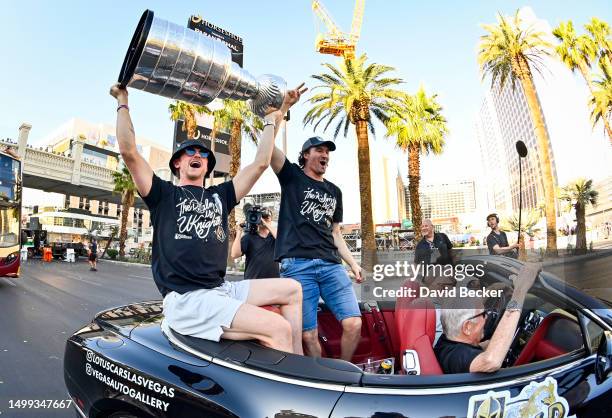 Jack Eichel and Mark Stone celebrate with the Stanley Cup during a victory parade and rally for the Vegas Golden Knights on the Las Vegas Strip on...