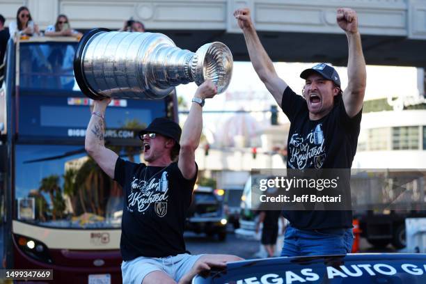 Jack Eichel and Mark Stone celebrate with the Stanley Cup during a victory parade and rally for the Vegas Golden Knights on the Las Vegas Strip on...