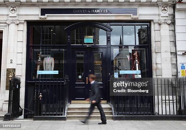 Pedestrian passes the Gieves & Hawkes store, owned by Trinity Ltd., on Savile Row in London, U.K., on Tuesday, Aug 7, 2012. U.K. Retail sales rose in...
