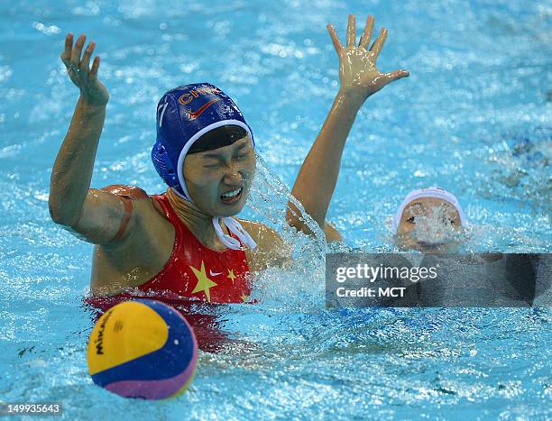 China defender Huizi Sun battle to maintain ball possession against Italy's Giulia Rambaldi, right, in the second half a women's water polo semifinal...