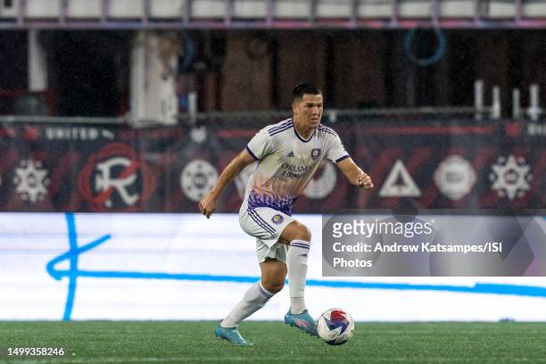 Cesar Araujo of Orlando City SC brings the ball forward during a game between Orlando City SC and New England Revolution at Gillette Stadium on June...