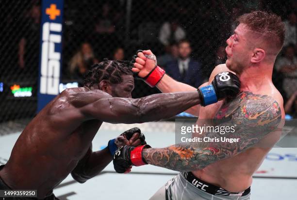 Jared Cannonier punches Marvin Vettori of Italy in a middleweight fight during the UFC Fight Night event at UFC APEX on June 17, 2023 in Las Vegas,...