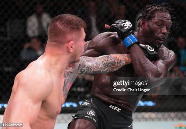 Marvin Vettori of Italy punches Jared Cannonier in a middleweight fight during the UFC Fight Night event at UFC APEX on June 17, 2023 in Las Vegas,...