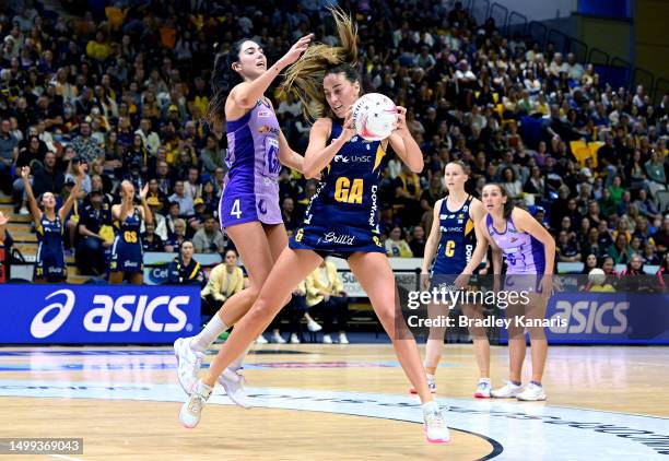 Cara Koenen of the Lightning and Remi Kamo of the Firebirds challenge for the ball during the round 14 Super Netball match between Sunshine Coast...