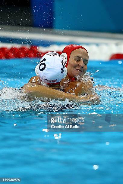 Goal keeper Betsey Armstrong and Kelly Rulon of the United States celebrate after they won 11-9 against Australia during the Women's Water Polo...