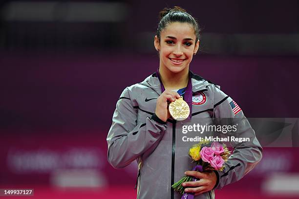 Gold medalist Alexandra Raisman of the United States poses on the podium during the medal ceremony for the Artistic Gymnastics Women's Floor Exercise...