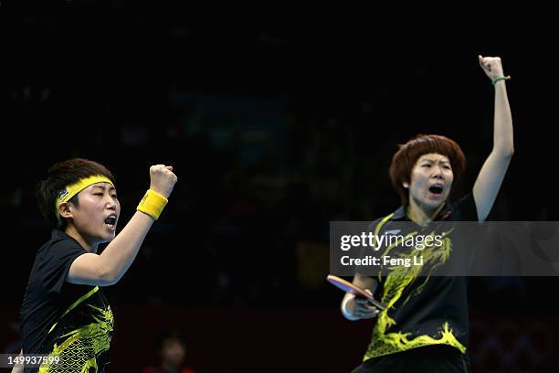 Xiaoxia Li and Yue Guo of China celebrate defeating Japan to win the Women's Team Table Tennis gold medal match on Day 11 of the London 2012 Olympic...