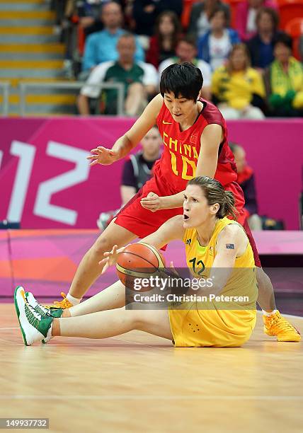 Belinda Snell of Australia attempts to pass the ball under pressure from Fan Zhang of China during the Women's Basketball quaterfinal on Day 11 of...