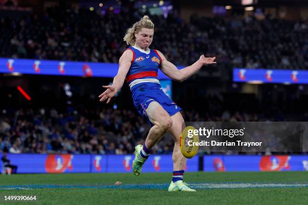 Cody Weightman of the Bulldogs kicks a goal during the round 14 AFL match between North Melbourne Kangaroos and Western Bulldogs at Marvel Stadium,...