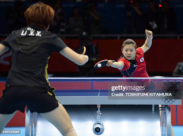 Japan's Ai Fukuhara returns the ball towards China's Li Xiaoxia during the 2012 London Olympic Games table tennis women's team gold medal match at...