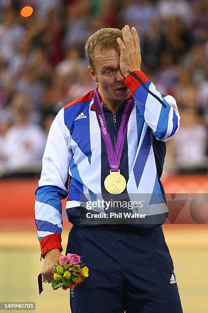 Gold medallist Sir Chris Hoy of Great Britain celebrates during the medal ceremony for the Men's Keirin Track Cycling Final on Day 11 of the London...