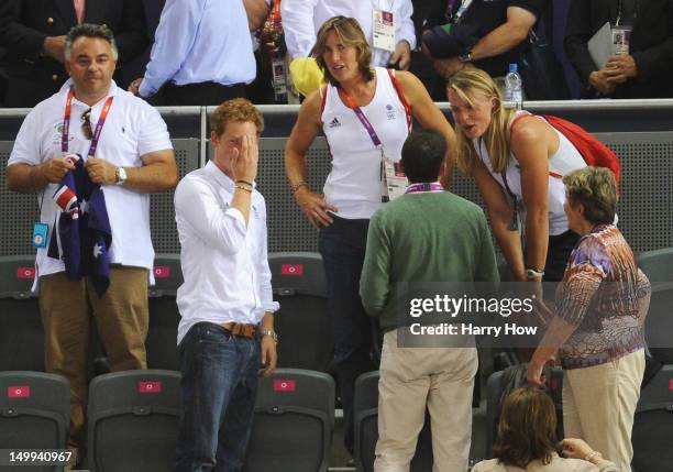 Prince Harry chats to Rowers Katherine Grainger and Anna Watkins of Great Britain at the Track Cycling on Day 11 of the London 2012 Olympic Games at...