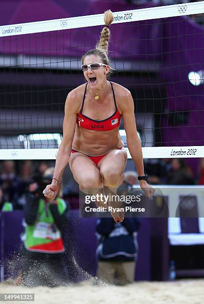 Kerri Walsh Jennings of the United States celebrates after winning match point during the Women's Beach Volleyball Semi Final match between United...