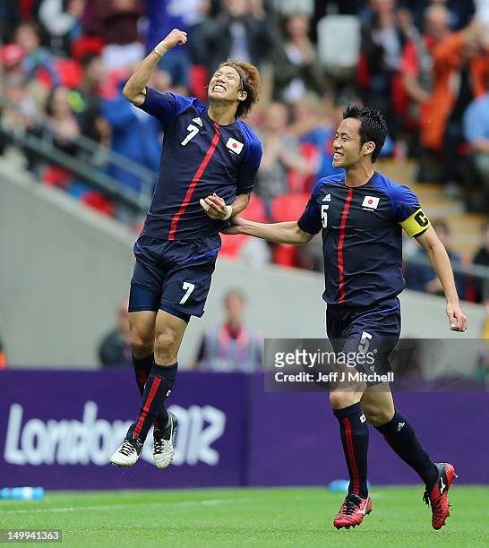 Yuki Otsu of Japan celebrates with Maya Yoshida during the Men's Football Semi Final match between Mexico and Japan, on Day 11 of the London 2012...