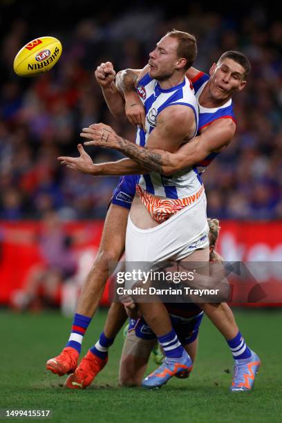 Rory Lobb of the Bulldogs tackles Ben McKay of the Kangaroos during the round 14 AFL match between North Melbourne Kangaroos and Western Bulldogs at...