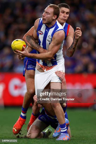 Rory Lobb of the Bulldogs tackles Ben McKay of the Kangaroos during the round 14 AFL match between North Melbourne Kangaroos and Western Bulldogs at...