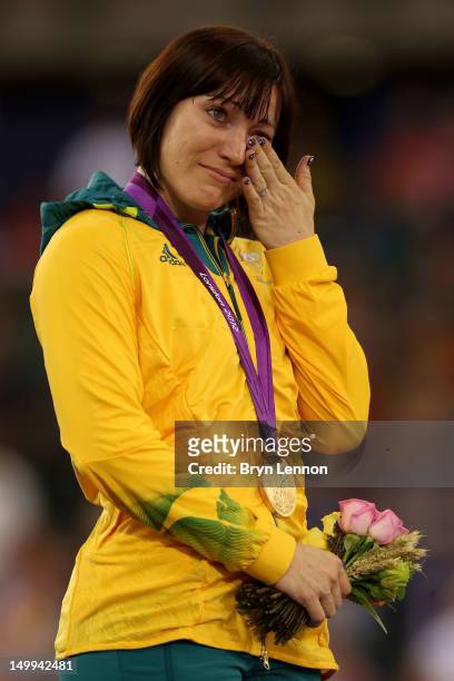 Gold medallist Anna Meares of Australia cries as she celebrates during the medal ceremony for the Women's Sprint Track Cycling Final on Day 11 of the...
