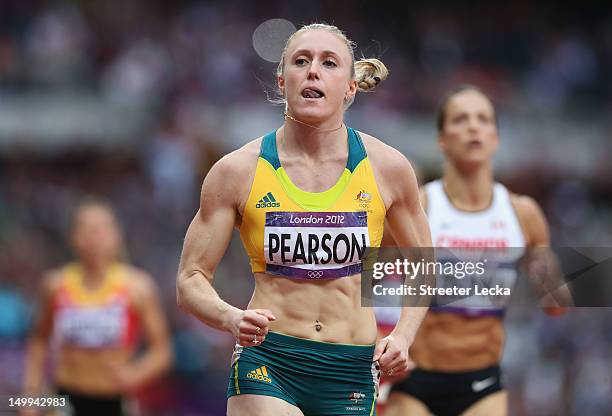 Sally Pearson of Australia leads Jessica Zelinka of Canada in the Women's 100m Hurdles Semifinals on Day 11 of the London 2012 Olympic Games at...