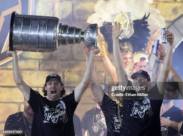 Mark Stone and Brayden McNabb of the Vegas Golden Knights celebrate with the Stanley Cup onstage during a victory parade and rally for the Golden...