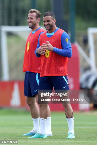 Harry Kane and Kyle Walker of England react during a training session at Carrington Training Ground on June 18, 2023 in Manchester, England.