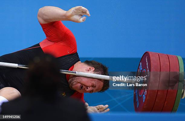 Matthias Steiner of Germany lies on the floor after failing to lift in the Men's +105kg Weightlifting final on Day 11 of the London 2012 Olympic...
