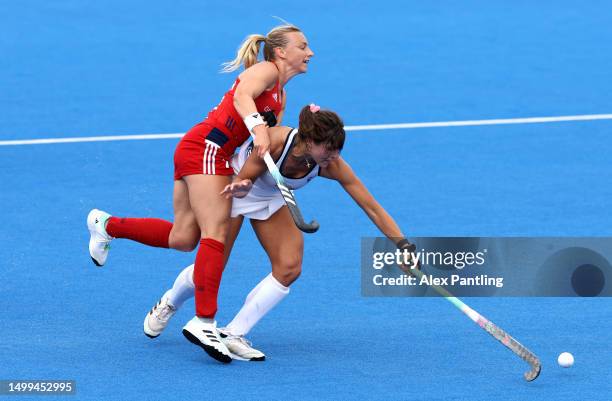 Hannah Martin of Great Britain tackles Meredith Sholder of The United States during the FIH Hockey Pro League Women's match between Great Britain and...