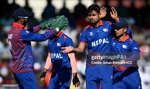 Gulshan Jha of Nepal celebrates with teammates after taking the wicket of Wessley Madhevere of Zimbabwe during the ICC Men's Cricket World Cup...