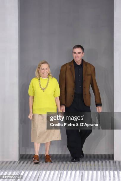 Fashion designers Miuccia Prada and Raf Simons walks the runway at the Prada Spring/Summer 2024 fashion show during the Milan Fashion Week menswear...