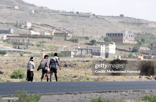 African immigrants seeking asylum in the Gulf States walk on foot along a highway leading to Saadah province to cross into Saudi Arabia, ahead of the...