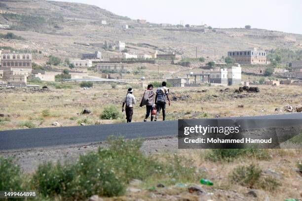 African immigrants seeking asylum in the Gulf States walk on foot along a highway leading to Saadah province to cross into Saudi Arabia, ahead of the...