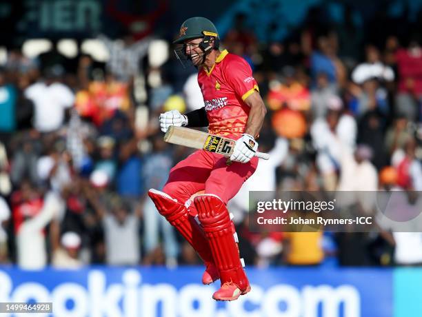 Craig Ervine of Zimbabwe celebrates after reaching their century during the ICC Men's Cricket World Cup Qualifier Zimbabwe 2023 match between...