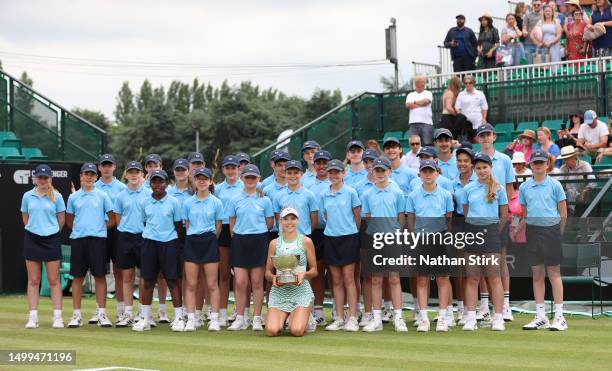 Katie Boulter of Great Britain poses with the ball crewe as she winsthe Women's Singles Rothesay Open Trophy after beating Jodie Burrage during the...