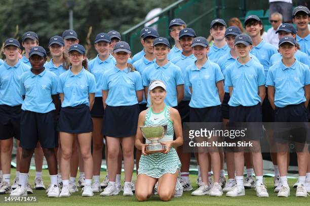 Katie Boulter of Great Britain poses with the ball crewe as she winsthe Women's Singles Rothesay Open Trophy after beating Jodie Burrage during the...