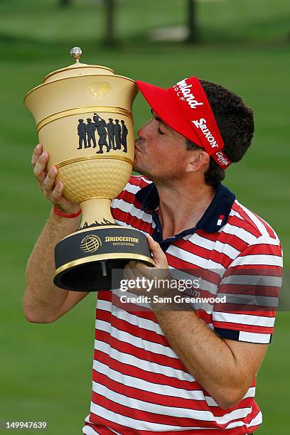 Keegan Bradley celebrates with the Gary Player trophy during the trophy presentation after winning the World Golf Championships-Bridgestone...