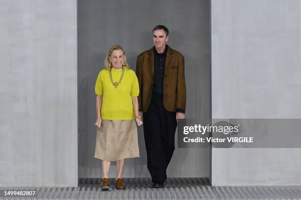 Fashion designers Miuccia Prada and Raf Simons walks the runway during the Prada Ready to Wear Spring/Summer 2024 fashion show as part of the Milan...