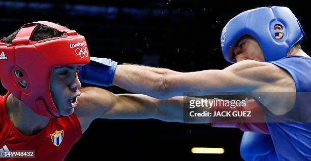 Robeisy Ramirez Carrazana Cuba fights with Andrew Selby of Great Britain during the Flyweight boxing quarterfinals of the 2012 London Olympic Games...