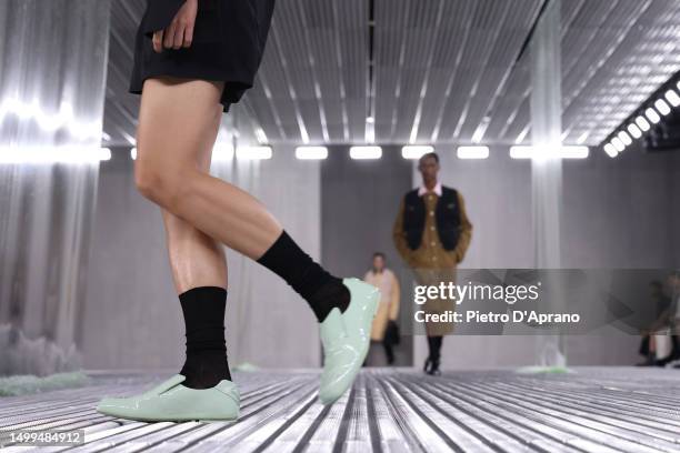 Model, shoe detail, walks the runway at the Prada Spring/Summer 2024 fashion show during the Milan Fashion Week menswear spring/summer 2024 on June...