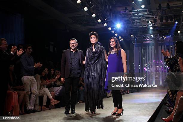 Kareena Kapoor walks the runway with designers Pankaj Ahuja & Nidhi Ahuja at The Grand Finale of The Lakme Fashion Week Winter/Festive 2012 day 5 at...