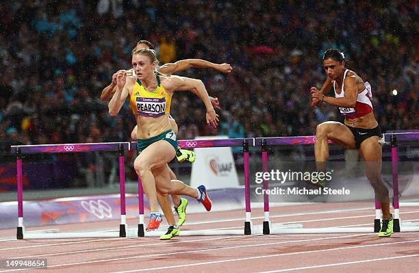 Sally Pearson of Australia leads Jessica Zelinka of Canada and Nevin Yanit of Turkey during the Women's 100m Hurdles Final on Day 11 of the London...
