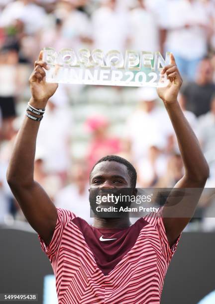 Frances Tiafoe of the United States celebrates with the trophy after victory over Jan-Lennard Struff of Germany during the mens final match on day...