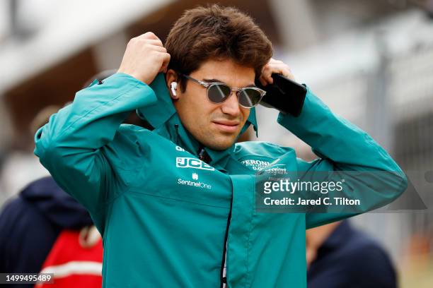 Lance Stroll of Canada and Aston Martin F1 Team looks on from the drivers parade prior to the F1 Grand Prix of Canada at Circuit Gilles Villeneuve on...