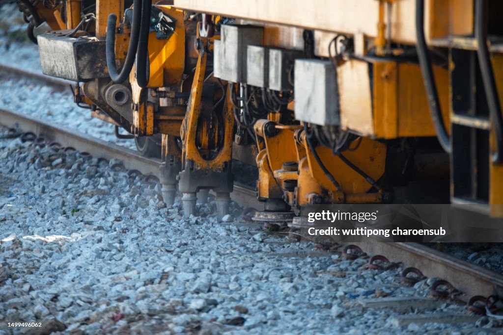 Maintenance railway on working a track tamping machine works on the tracks