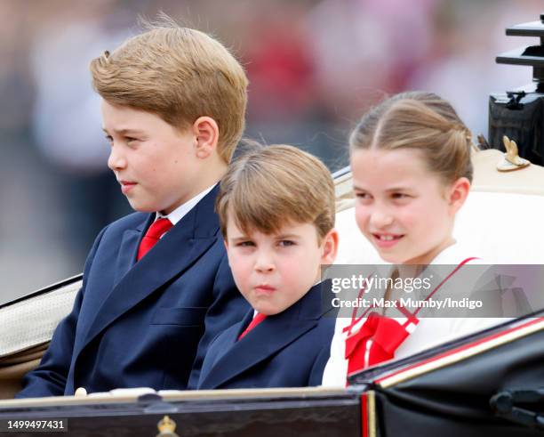 Prince George of Wales, Prince Louis of Wales and Princess Charlotte of Wales depart Buckingham Palace in a horse drawn carriage to attend Trooping...