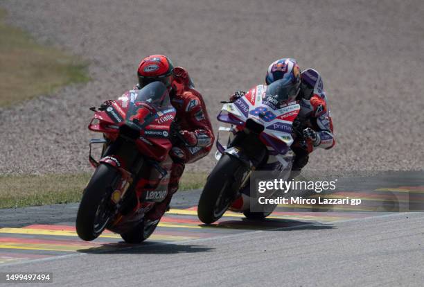 Francesco Bagnaia of Italy and Ducati Lenovo Team leads Jorge Martin of Spain and Pramac Racing during the MotoGP race during the MotoGP of Germany -...