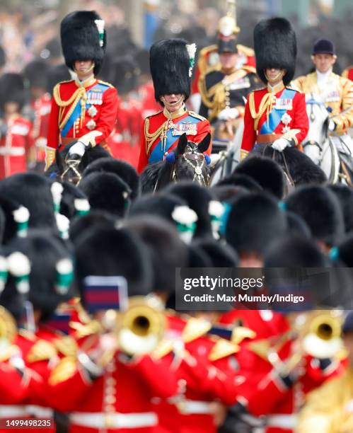 King Charles III , wearing his Welsh Guards uniform, Prince William, Prince of Wales and Prince Edward, Duke of Edinburgh ride, on horseback, down...