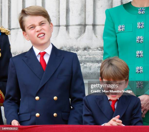 Prince George of Wales and Prince Louis of Wales watch an RAF flypast from the balcony of Buckingham Palace during Trooping the Colour on June 17,...